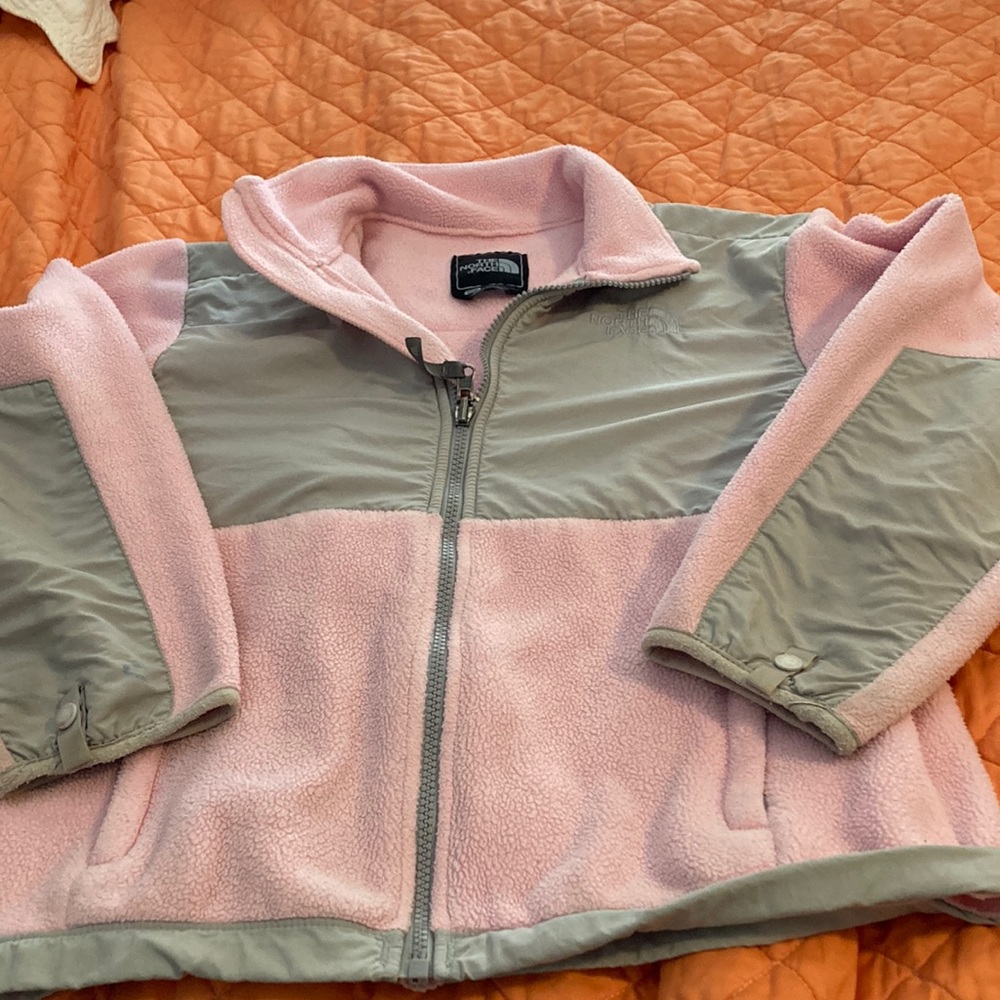 Girl’s North face jacket.  Medium, Used, minor flaws. Pink and grey.